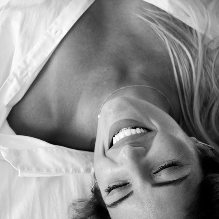 Asha Rao, Lead Design Curator at Calm Water Connection, reviewing corporate floral arrangements